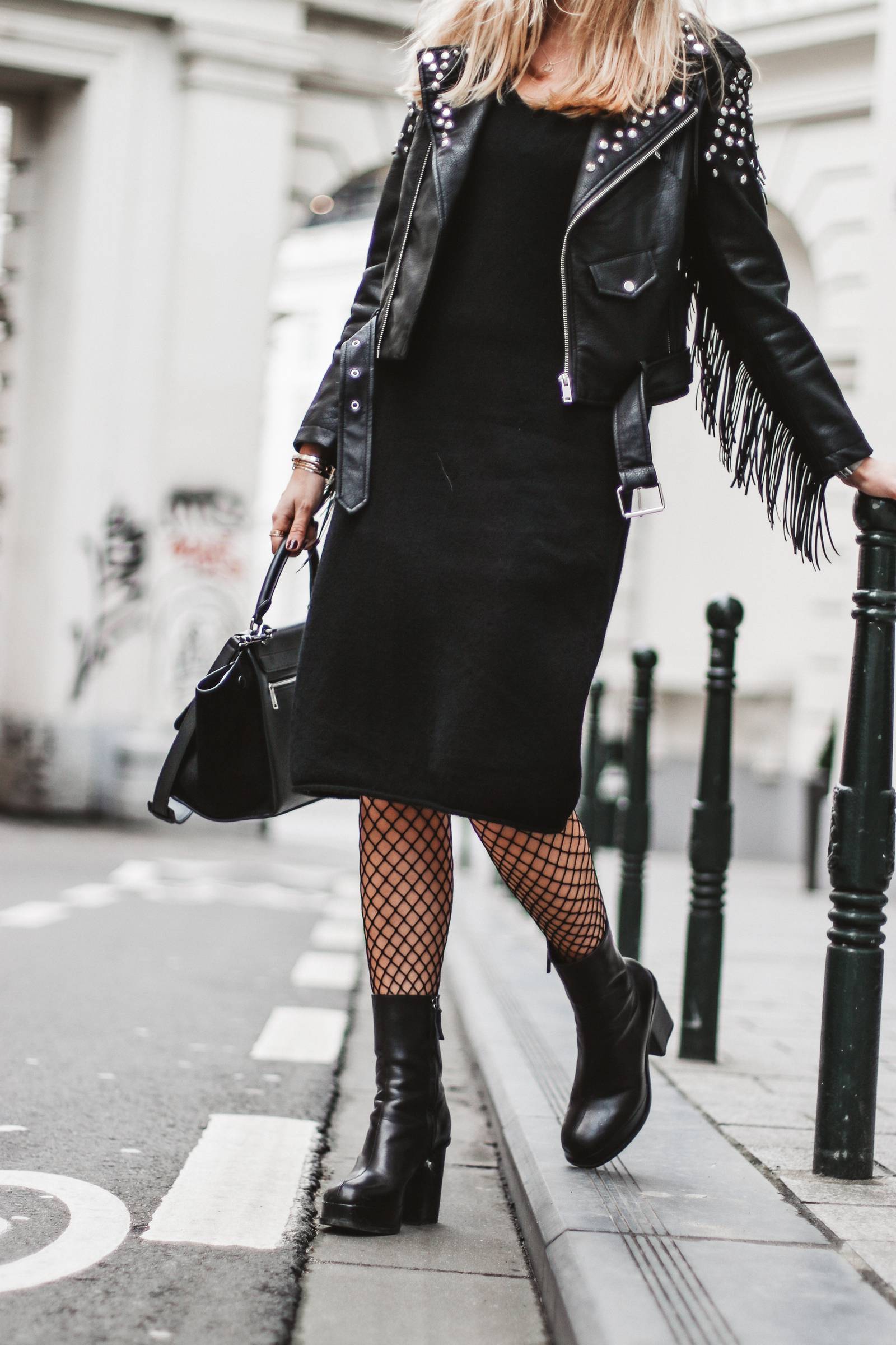 Fringed jacket, fishnet tights and Céline trapeze bag
